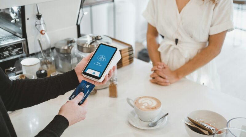 woman standing and holding smartphones